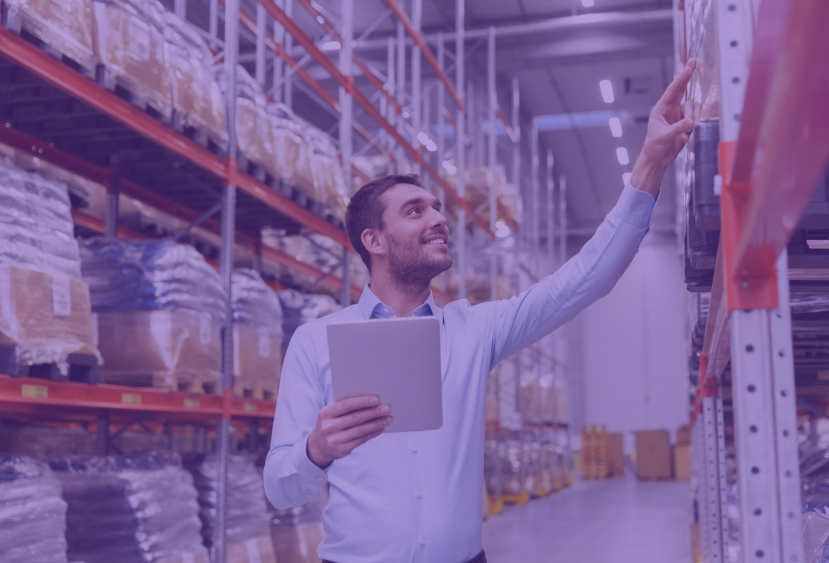 man-checking-goods-at-warehouse